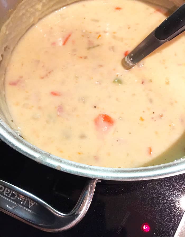 Closeup shot of a large pot of potato soup.