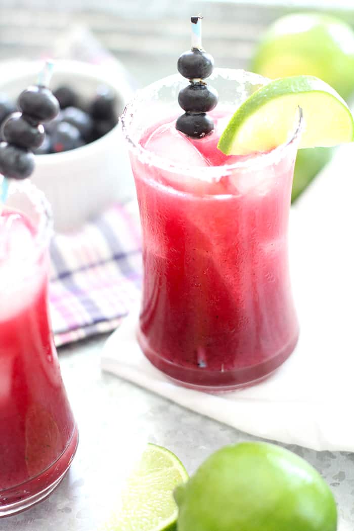 Side shot of a blueberry lime margarita.