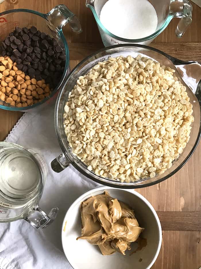 A board with all the ingredients on top in separate bowls.