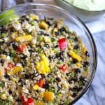 Mexican Quinoa Salad is protein packed, with two cups of quinoa, black beans, peppers, jalapeños, green onions, fresh corn, and Cotija cheese! | suebeehomemaker.com