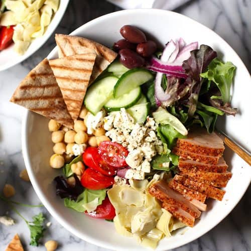 Overhead view of a bowl of traditional Greek Salad with smoked turkey