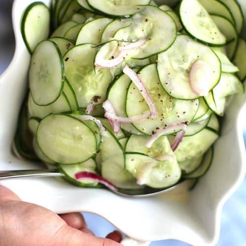 My Fresh Cucumber Salad recipe uses plain greek yogurt, honey, and apple cider vinegar in the dressing, along with fresh cucumbers and red onions! | suebeehomemaker.com