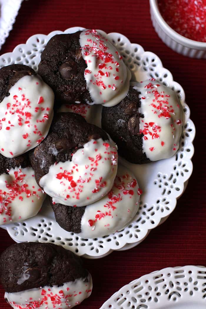 Dark Chocolate Peppermint Mocha Cookies take a simple chocolate cookie and make it festive by dipping in white chocolate topped with peppermint sprinkles! | suebeehomemaker.com