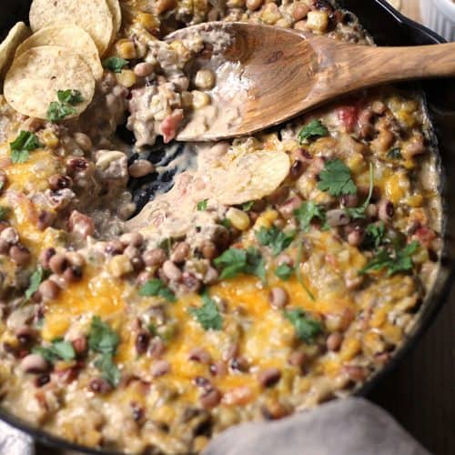 Mexican Black-Eyed Pea Dip is definitely on our New Year's menu. Southern Tradition states that black-eyed peas bring you luck in the new year! | suebeehomemaker.com