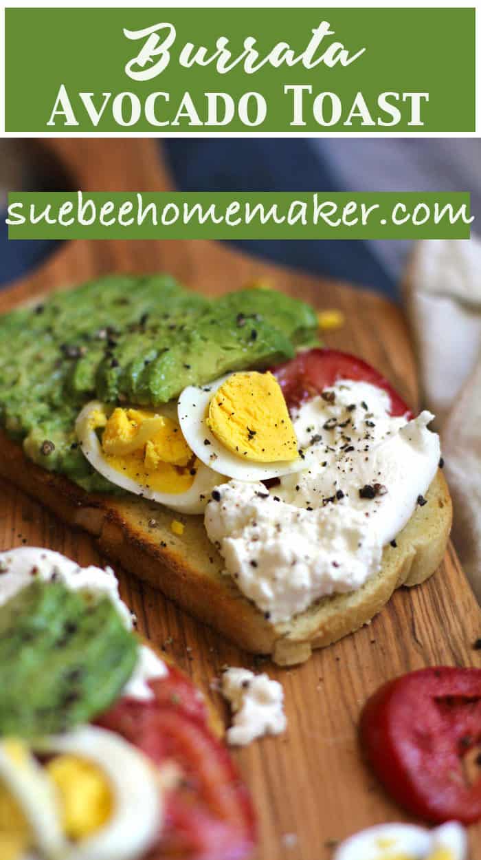 Some burrata avocado toast on a wooden board.