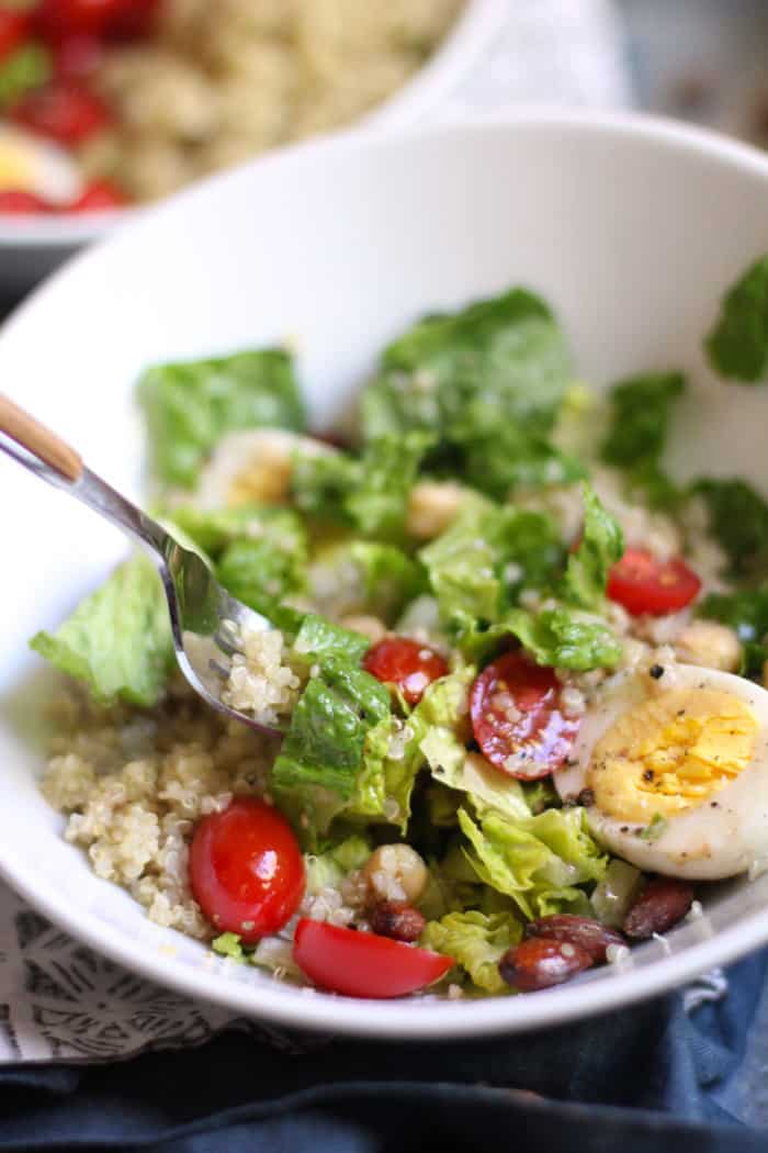 Closeup of a fork digging into the protein packed quinoa salad.