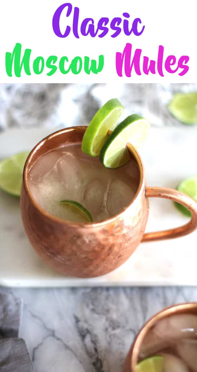 Overhead shot of two copper mugs of Moscow mules wit lime slices.