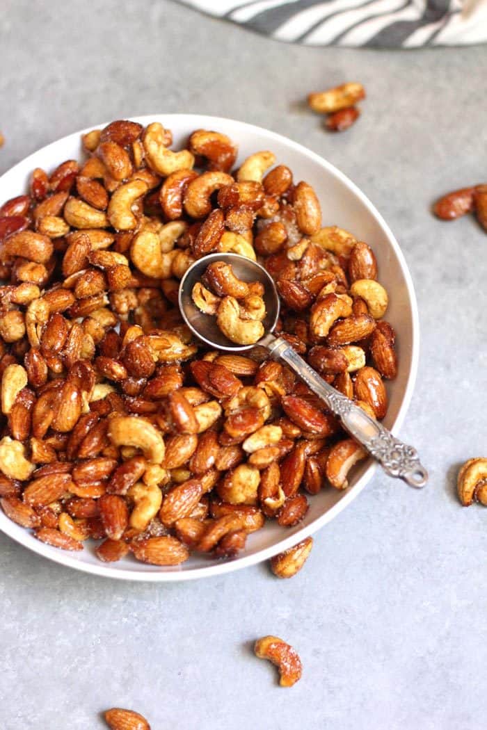 Honey Roasted Nuts are a simple mixture of nuts, honey, a few spices, and a little bit of sugar. Just 15 minutes in the oven, and serve them warm or cold! | suebeehomemaker.com