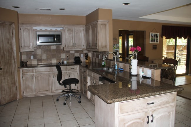 Another angle of old kitchen with half wall.