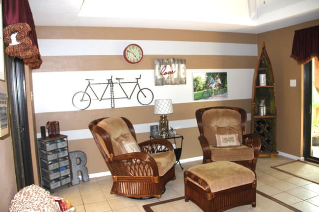 Before picture of sunroom with striped wall.