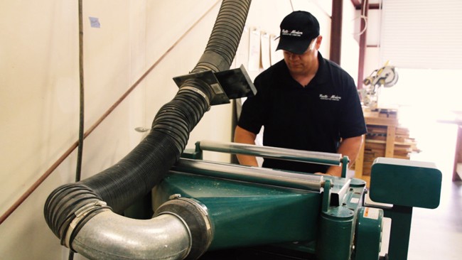 Picture of Ken Williams working in his shop.