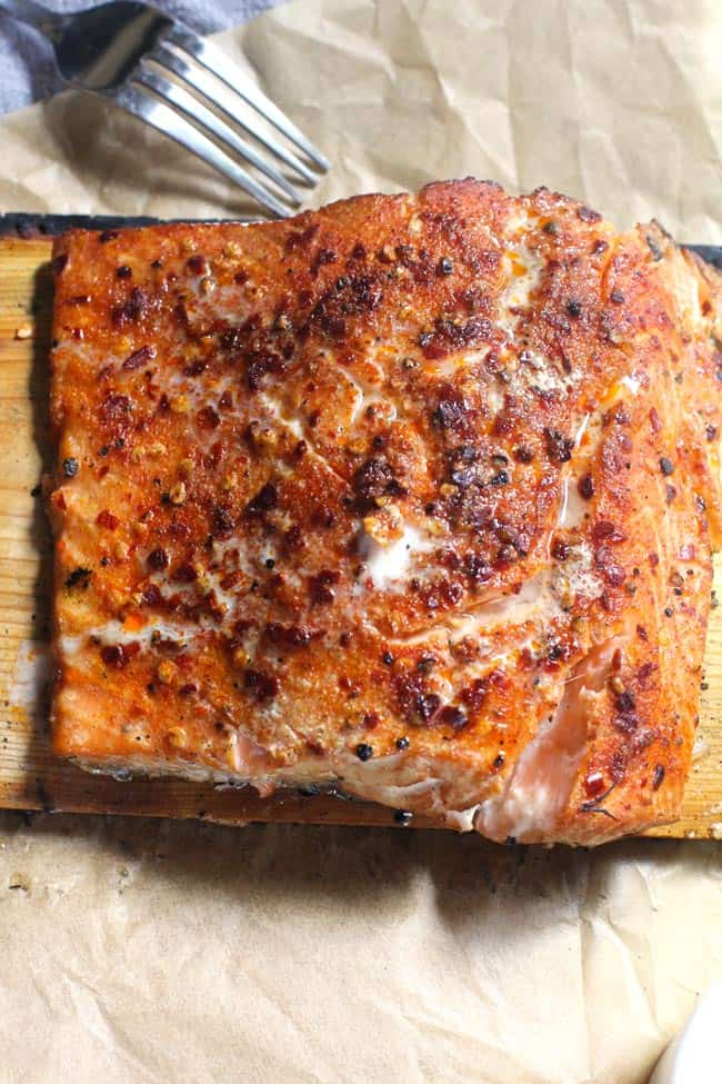 Overhead shot of Cedar Plank Salmon on brown parchment paper.