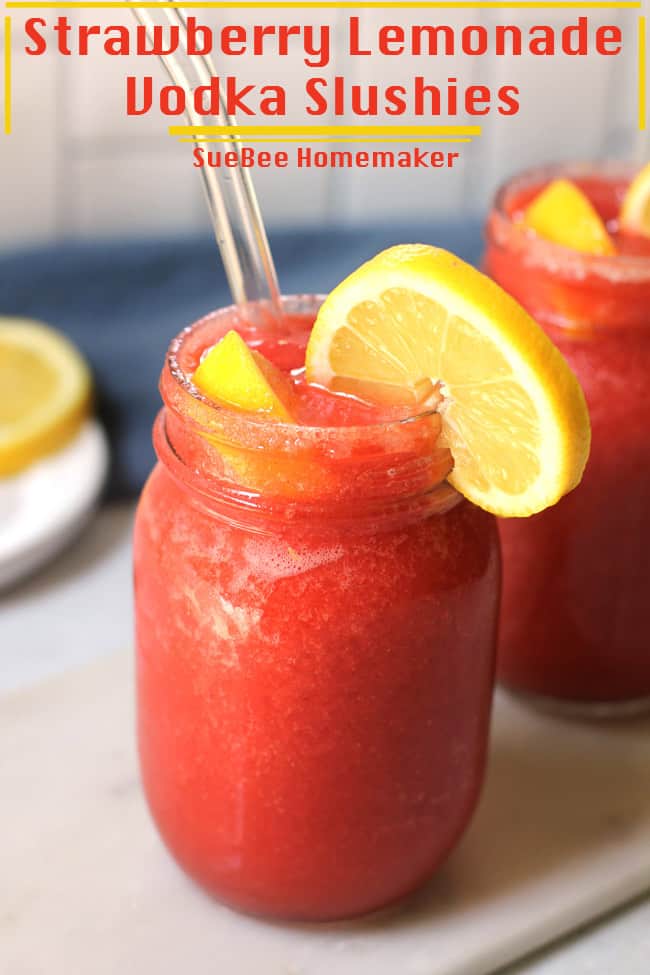 Two strawberry lemonade vodka slushies in glass mason jars.