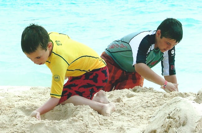 Josh and Zach making sandcastles in Cancun, Mexico.