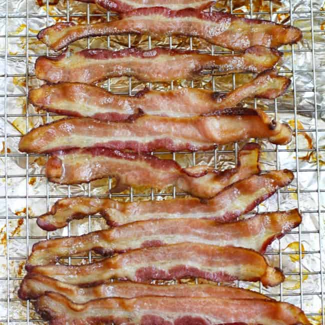 Cooked bacon on a wire rack.