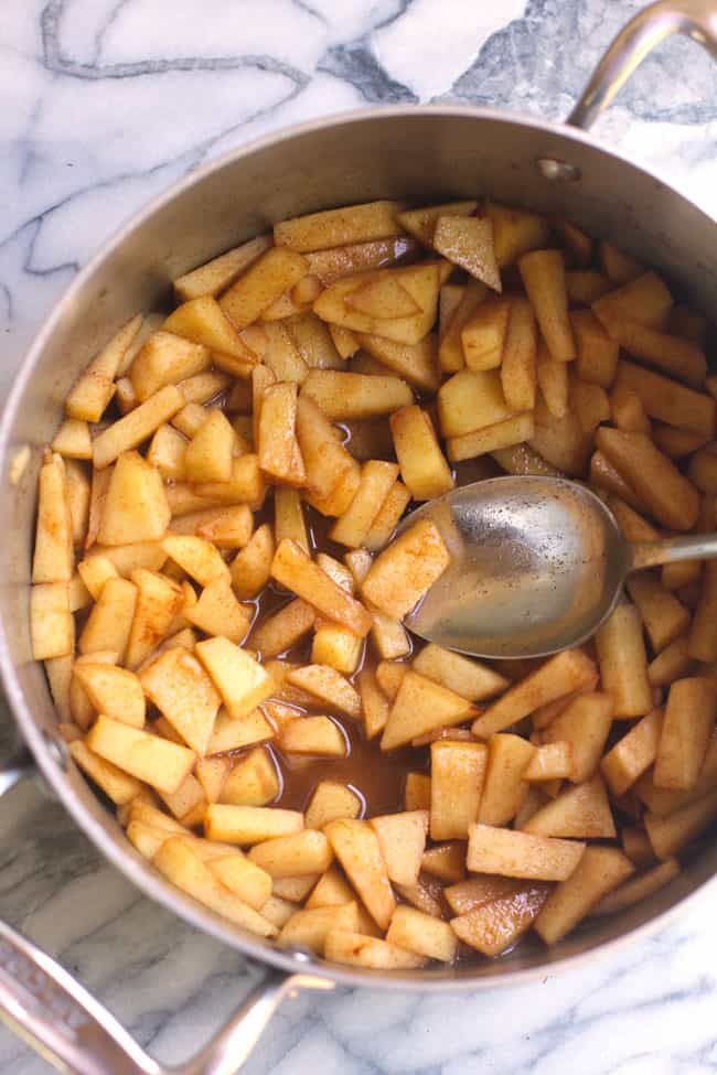 Overhead shot of a pan of cooked cinnamon apples.