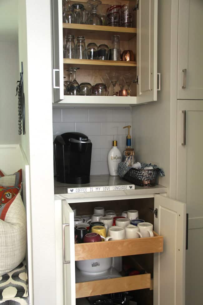 The drawers and cabinets open above and under the coffee bar.