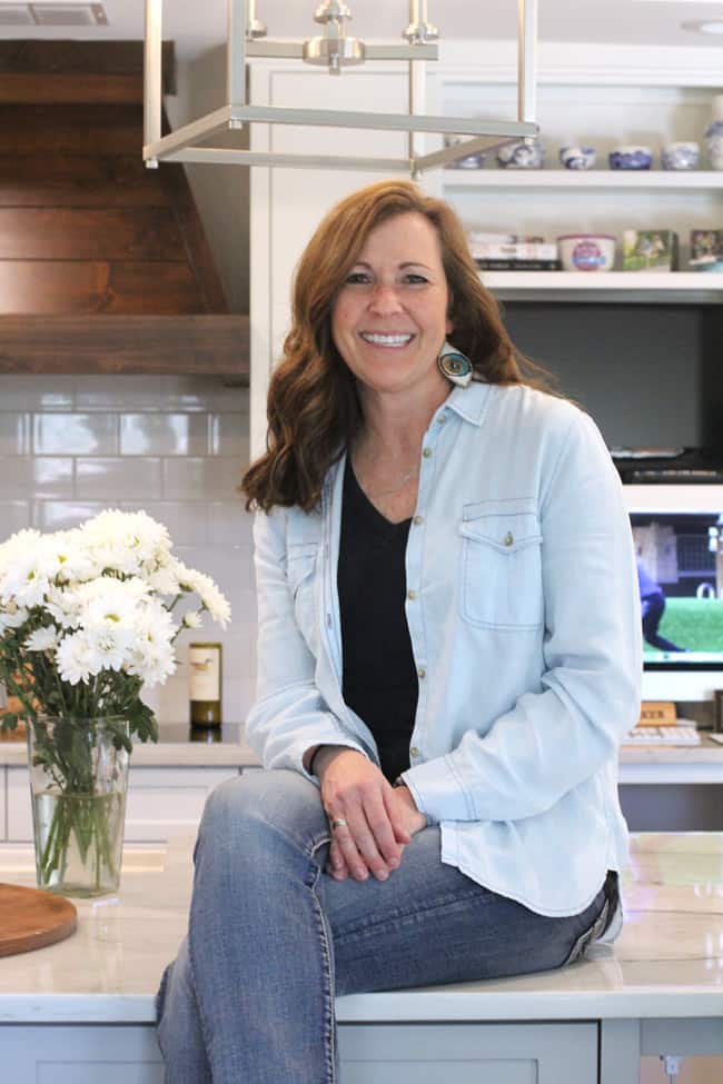 A picture of me sitting on my new kitchen island.