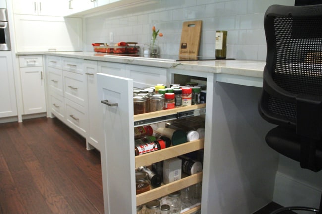 Open spice drawers by stove.