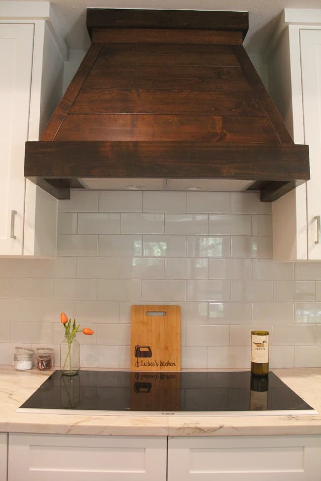 The wooden vent hood over the induction stove.