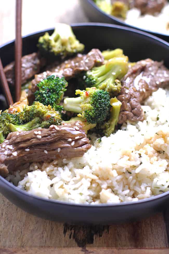 Side backlit shot of beef and broccoli over rice.