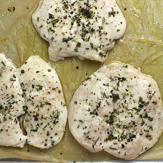 Three butterflied chicken breasts after slow roasting.