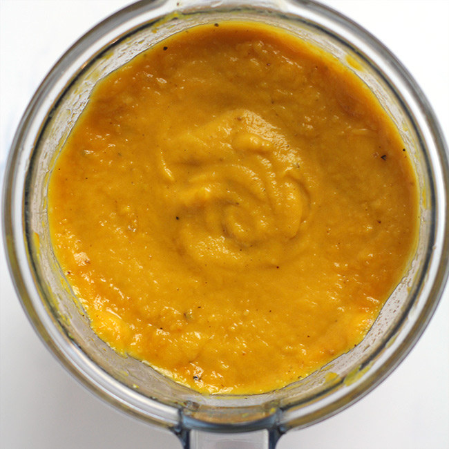 The pureed squash in a blender.