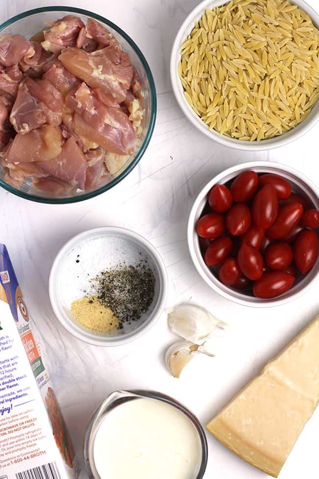 The ingredients needed for parmesan chicken orzo skillet.