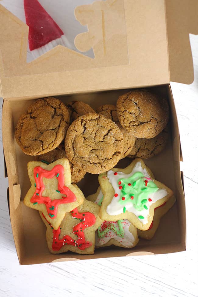 A box of Christmas cookies - gingersnaps and cut out sugar cookies.