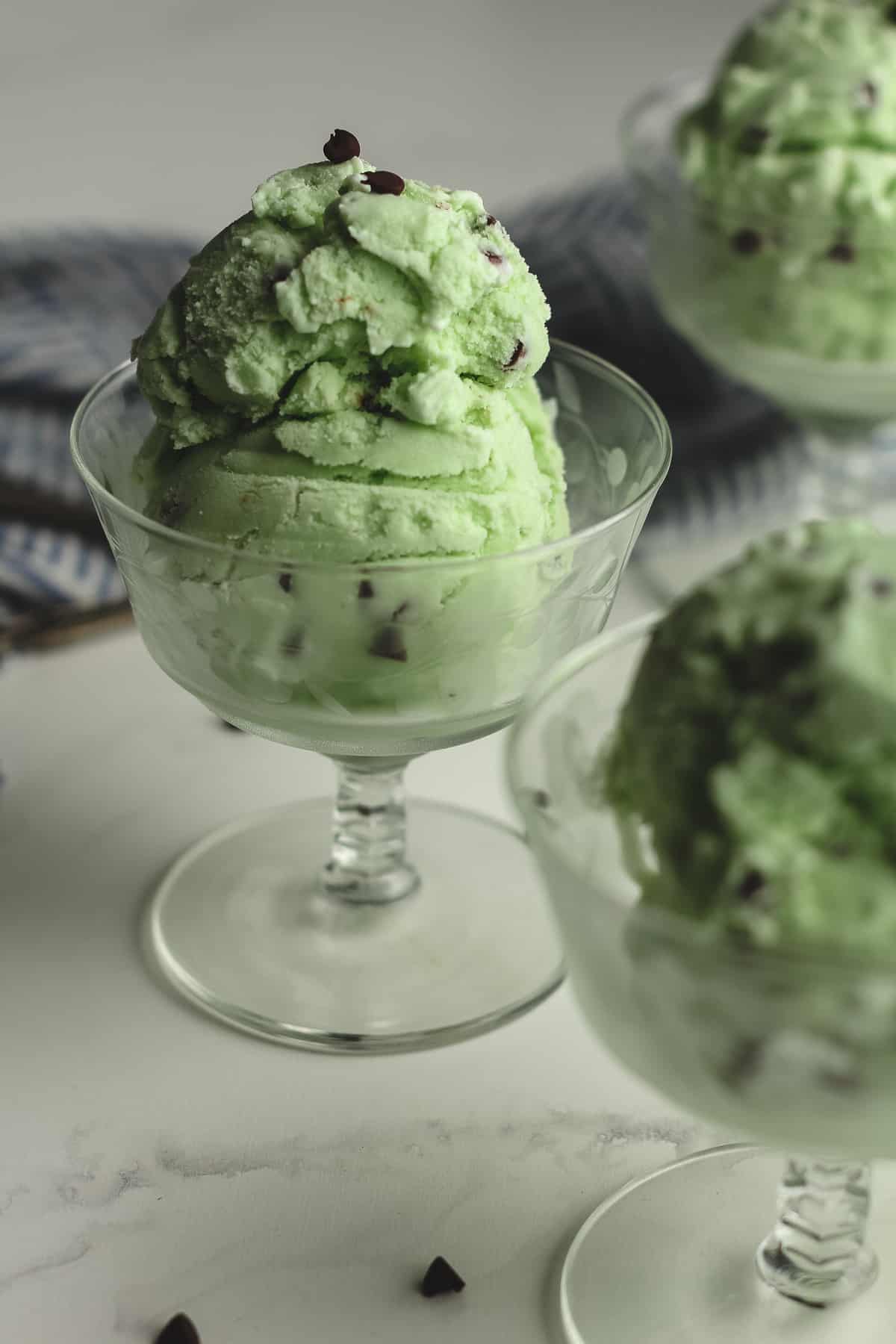 Side shot of three bowls of mint chip.