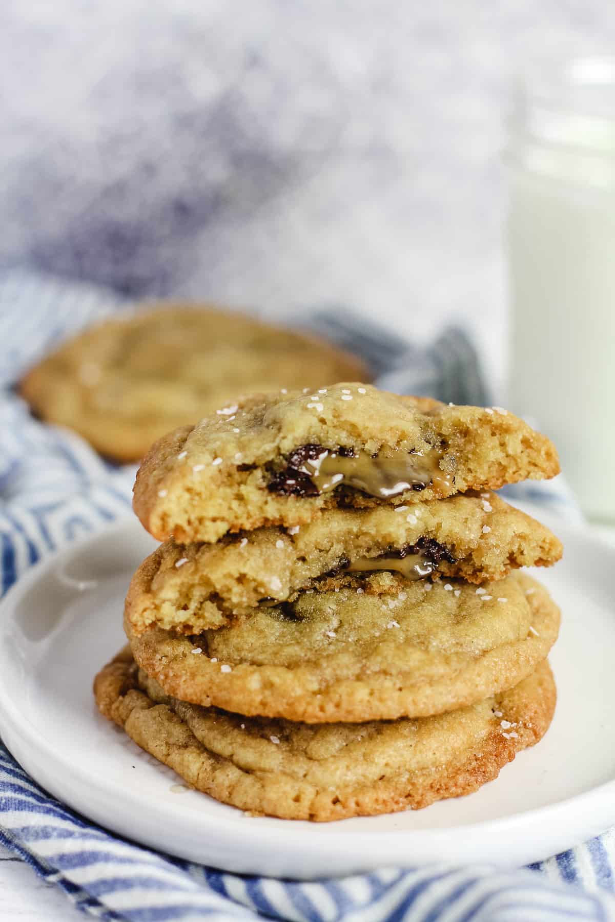 A stack of caramel stuffed cookies, showing the insides.