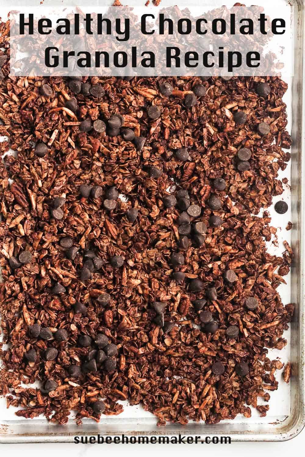 Overhead shot of a sheet pan of healthy chocolate granola.