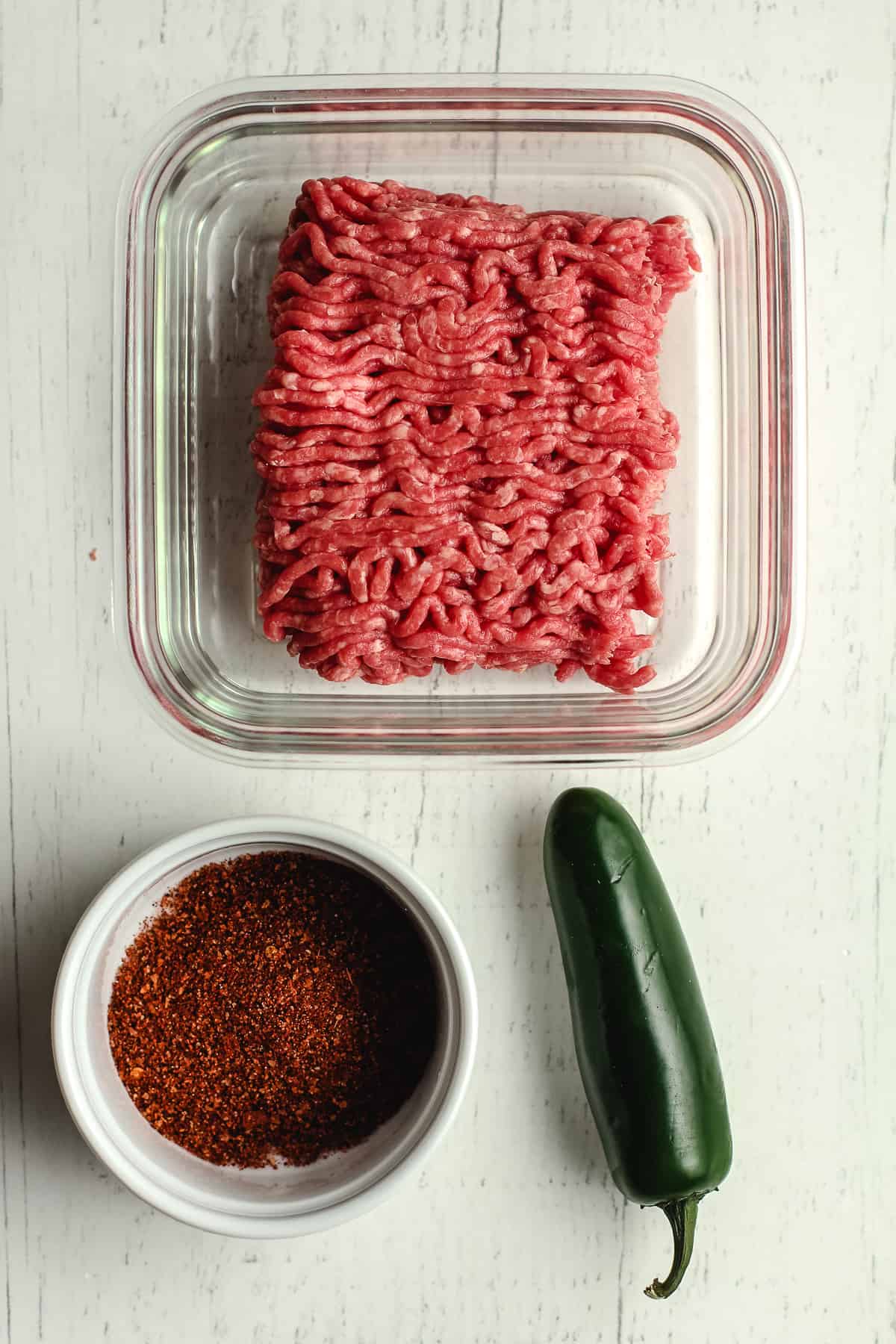 Ingredients for the taco meat - beef, taco seasoning, and jalapeño.
