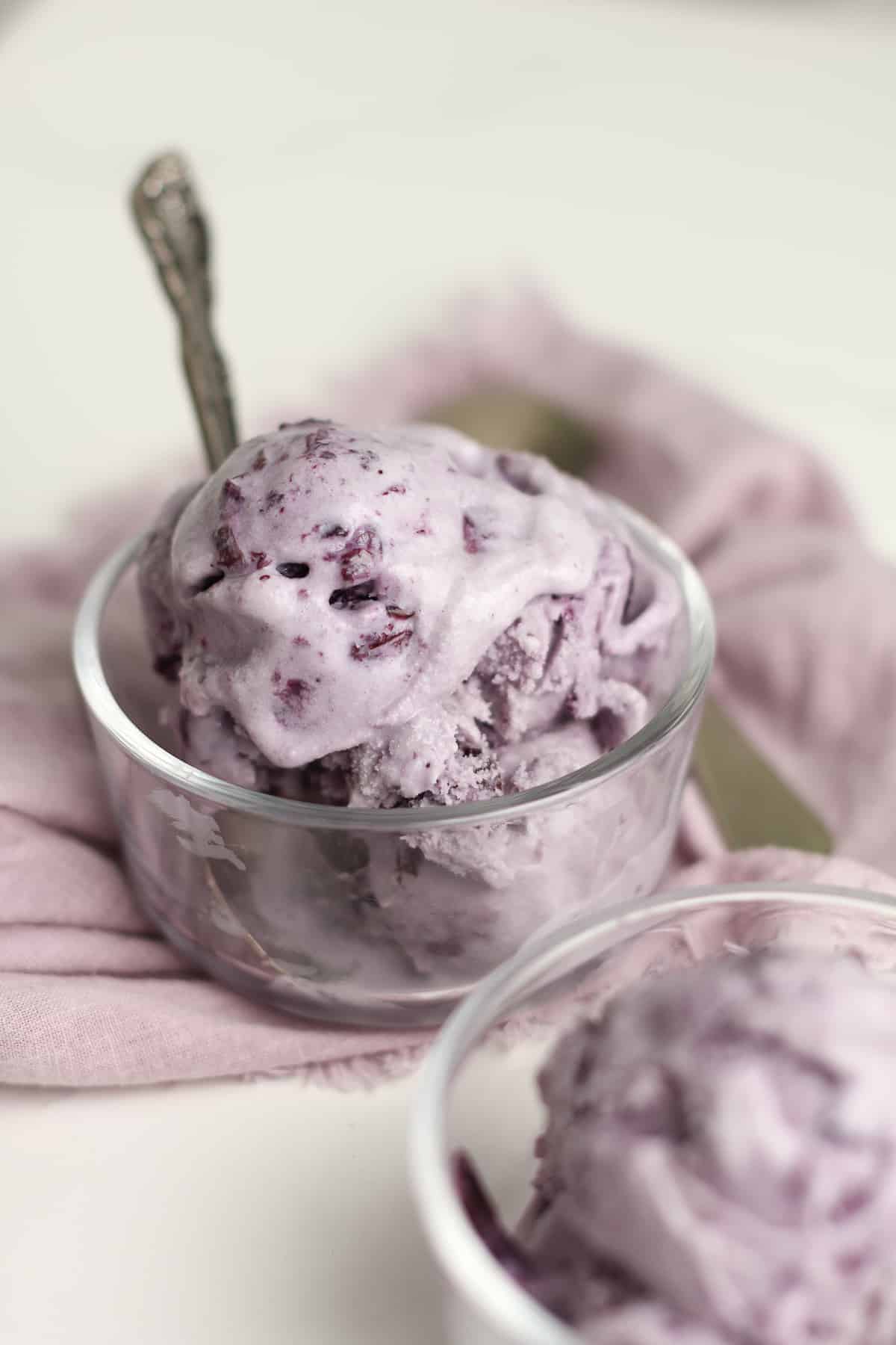A drippy scoop of blueberry ice cream.