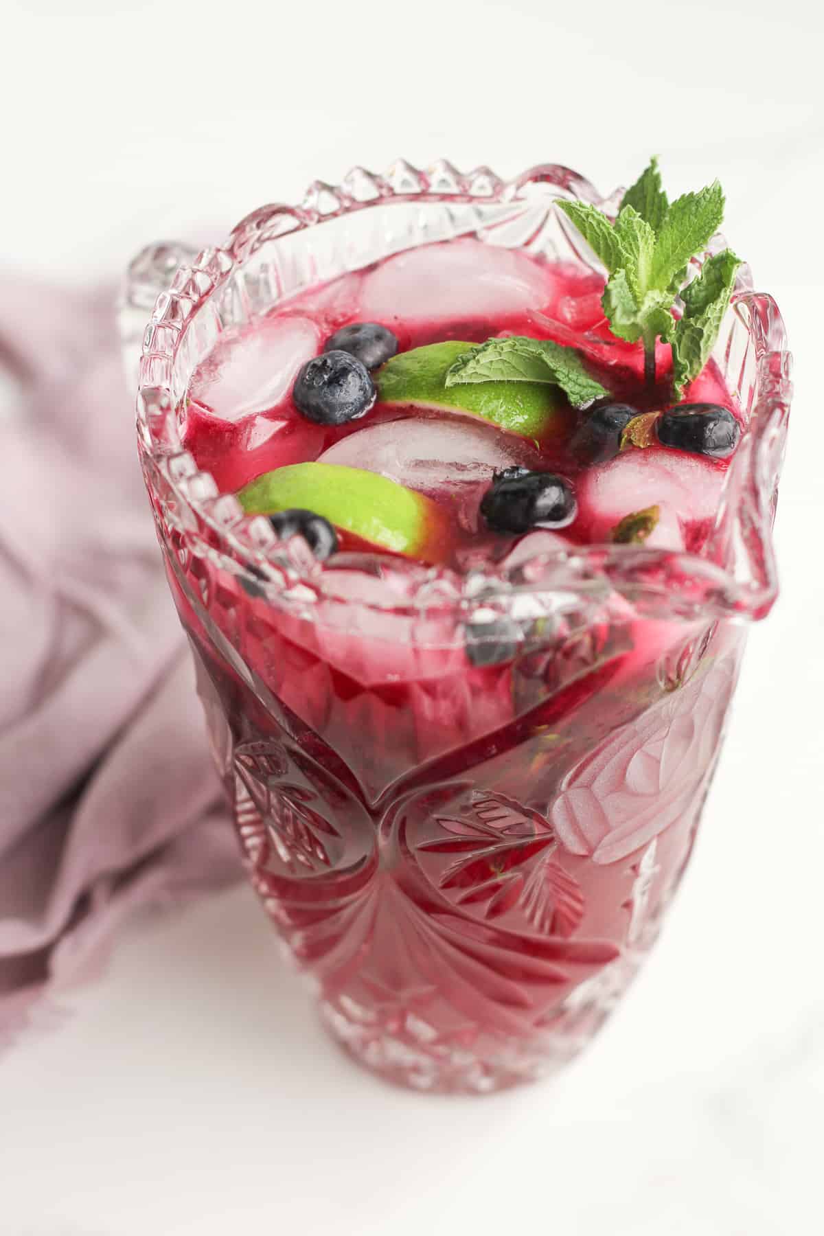 A pitcher of blueberry mojitos.