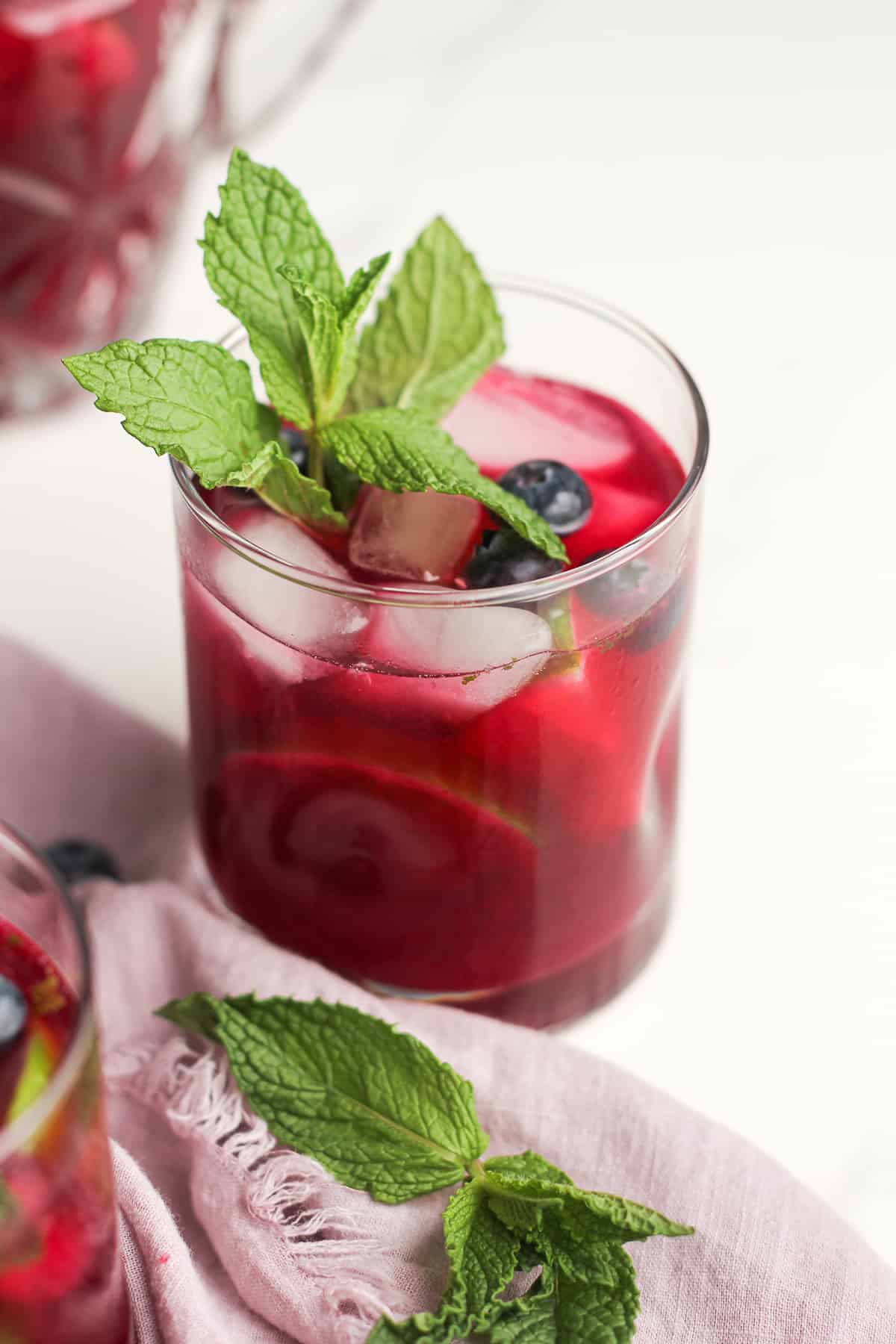 Blueberry mojitos with sprigs of mint.