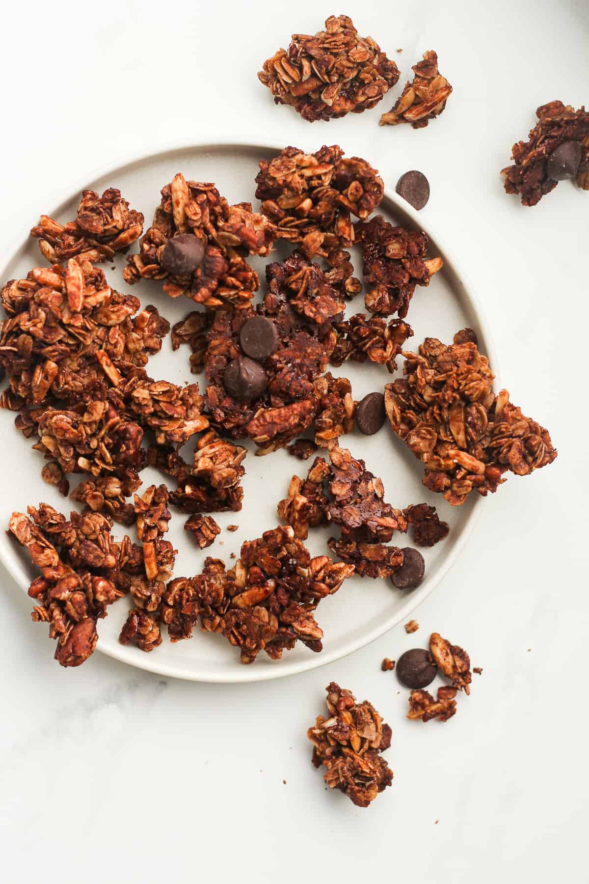 A plate of chocolate granola clusters.