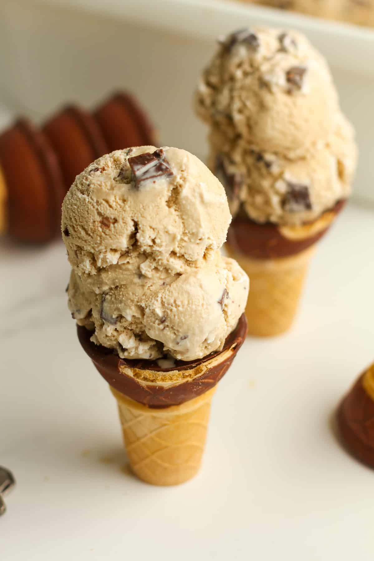 Two cones of coffee toffee ice cream.