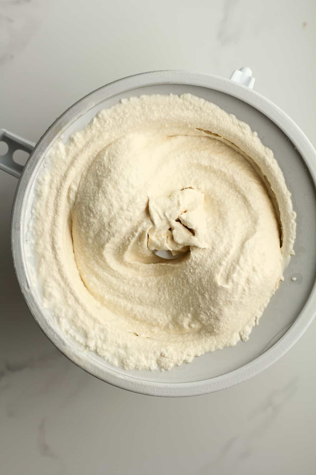 A KitchenAid attachment with the ice cream inside after churning.