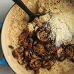 A stock pot of creamy mushroom risotto.