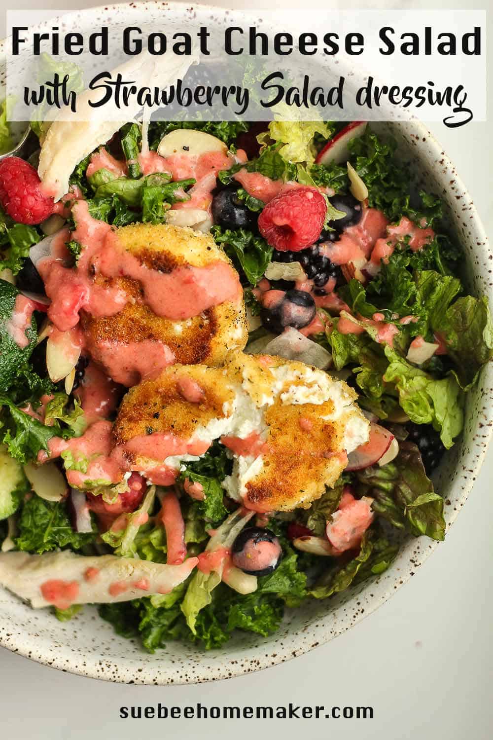 A bowl of fried goat cheese salad with strawberry dressing on top.