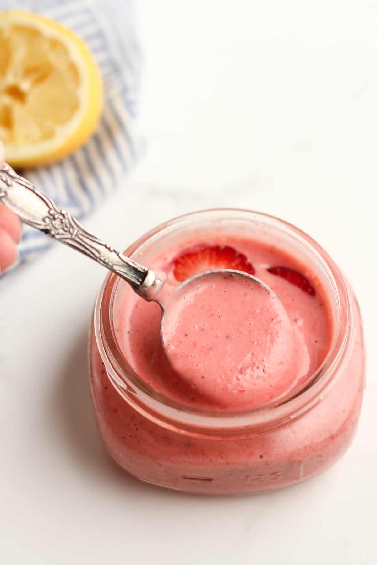 A spoonful of strawberry dressing.
