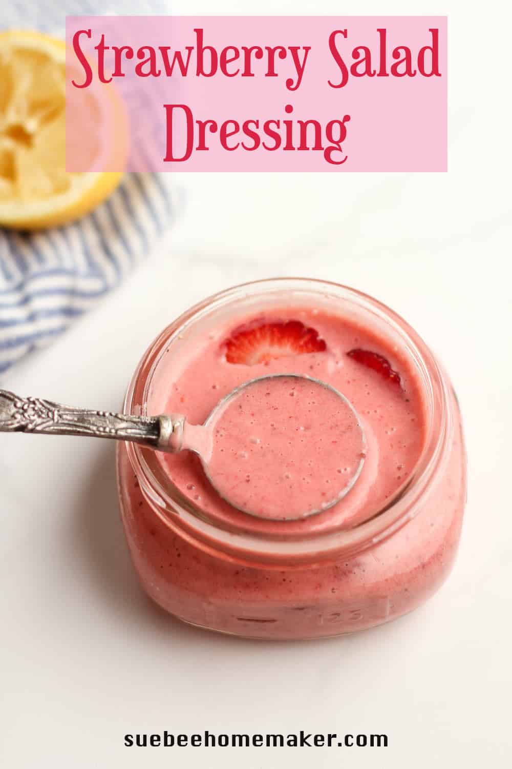 A jar of strawberry salad dressing.