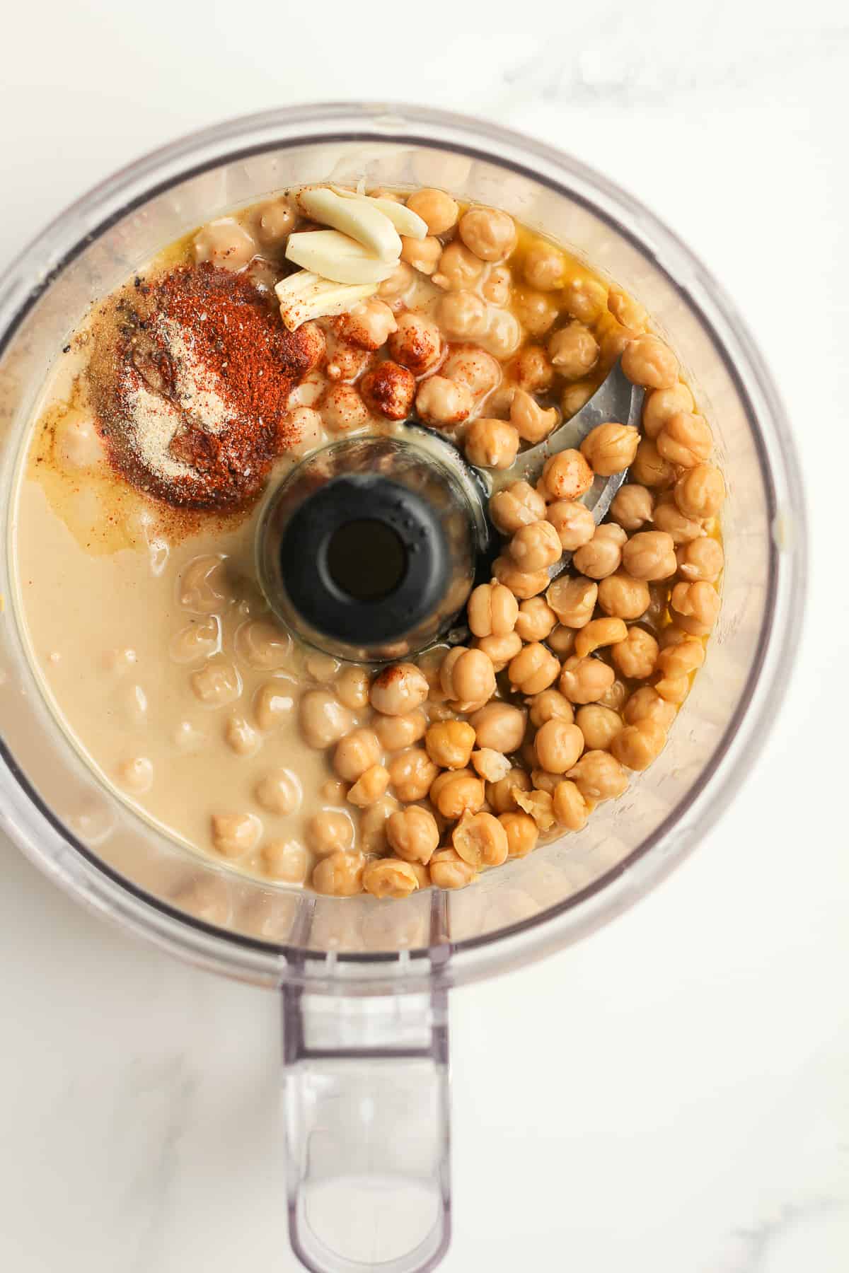 A food processor of the hummus ingredients before processing.
