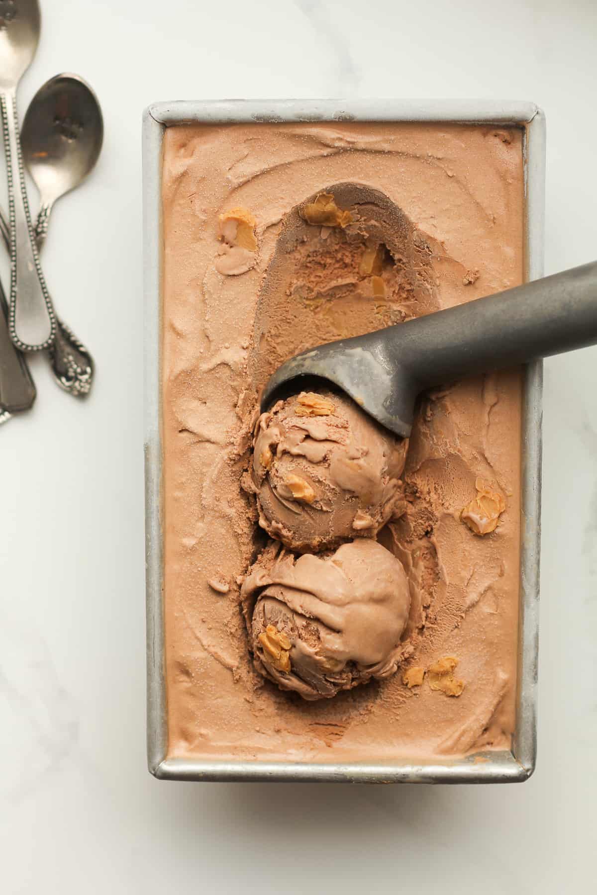 A rectangular pan with two scoops of ice cream on top.