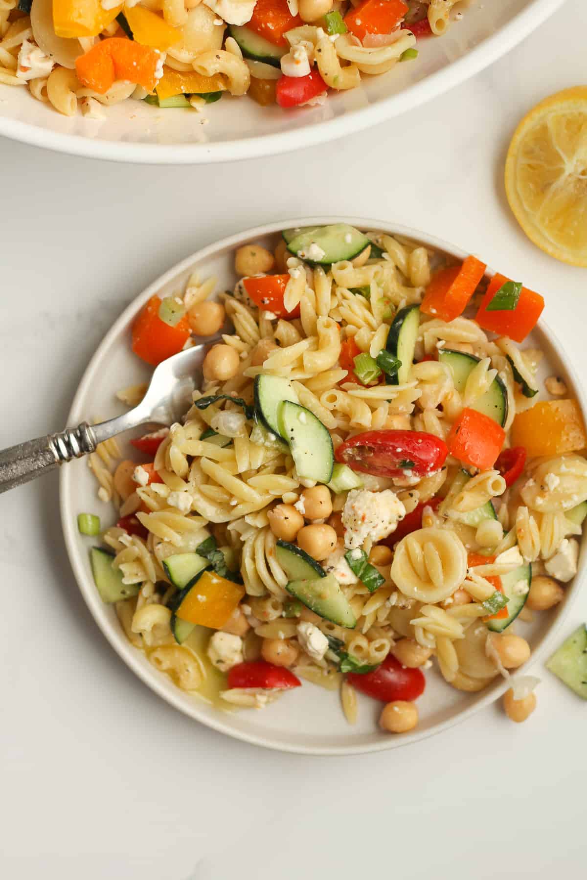 Overhead view of pasta salad with a fork.