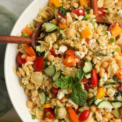 Closeup on a large bowl of summer pasta salad.