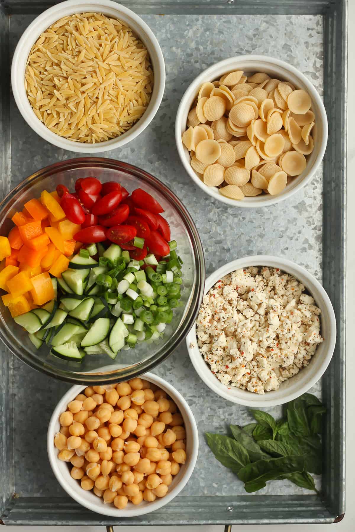 A tray of the pasta salad ingredients.