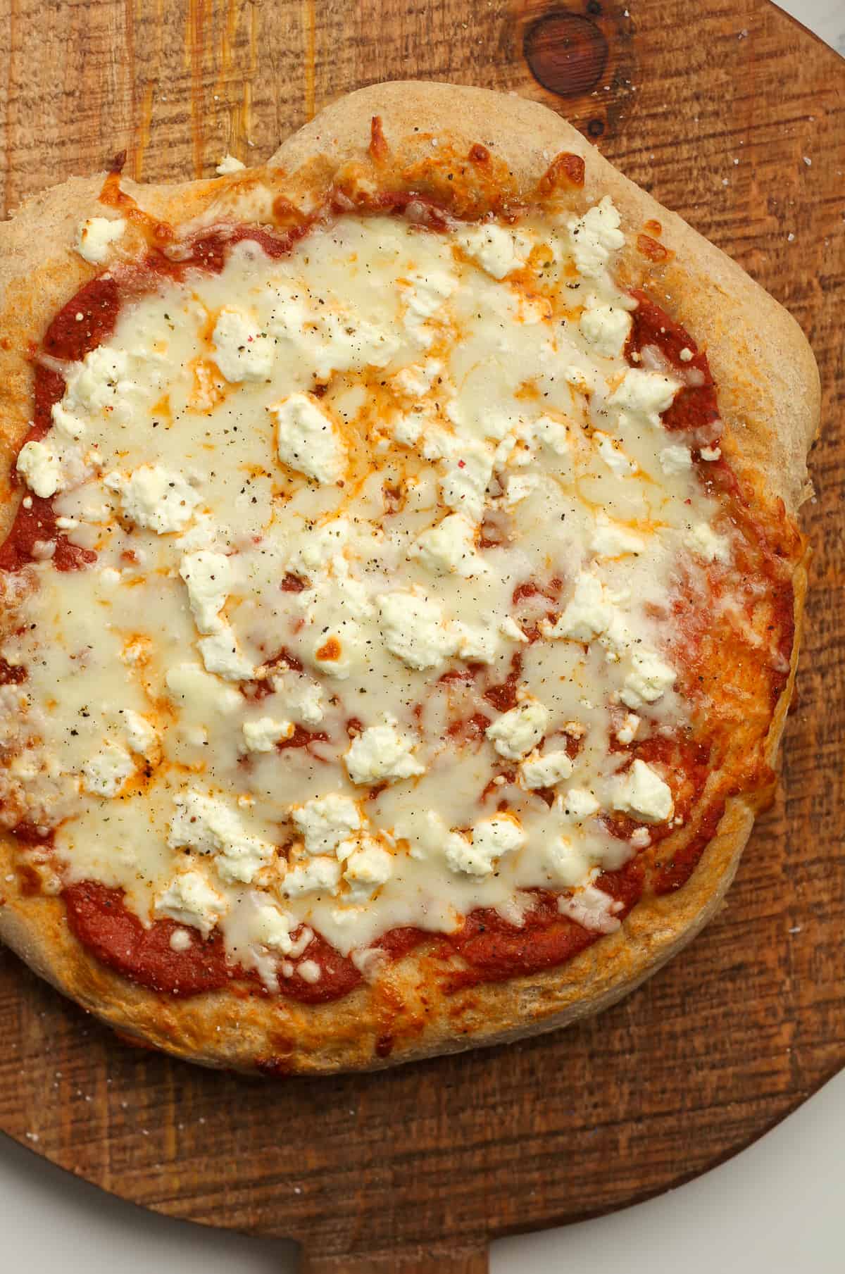 A baked whole wheat cheese pizza.