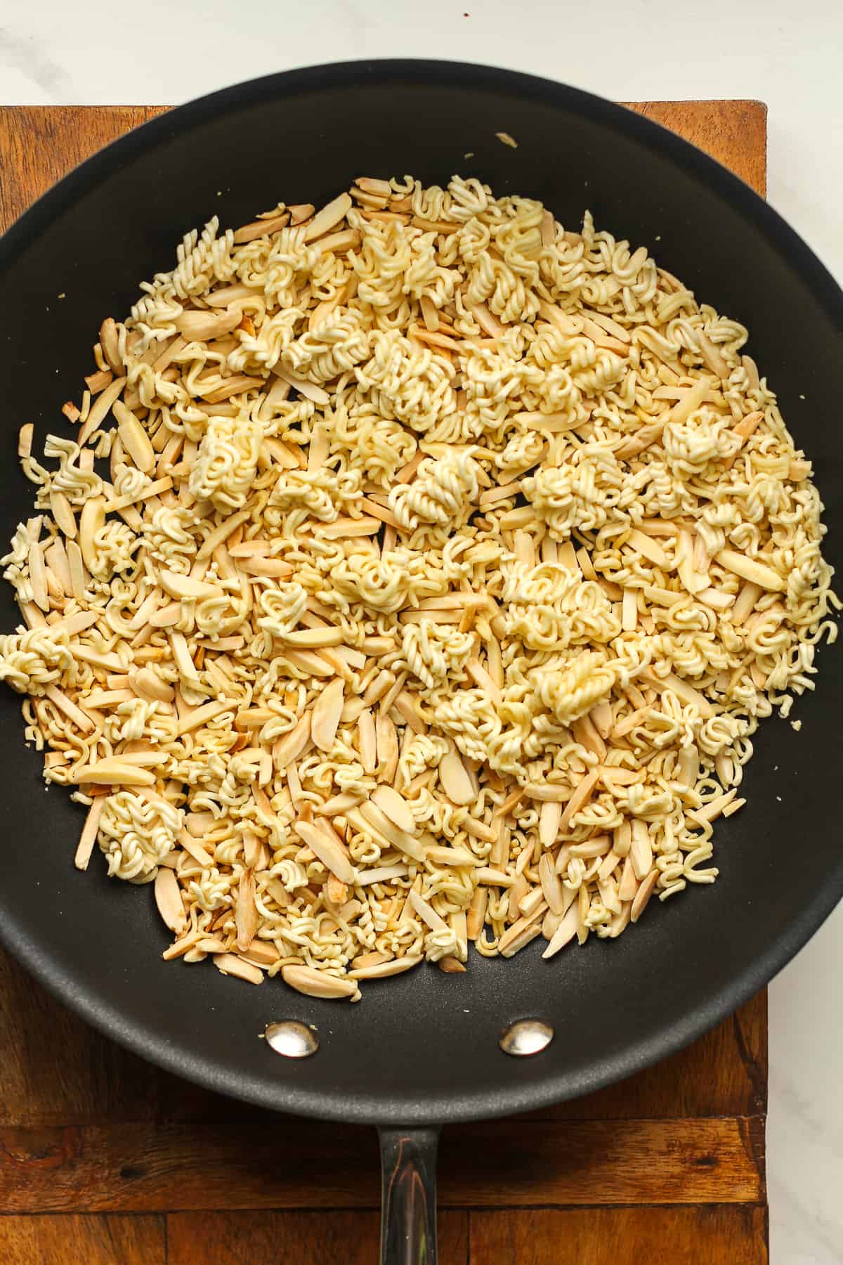 A pan of the toasted almonds and ramen.